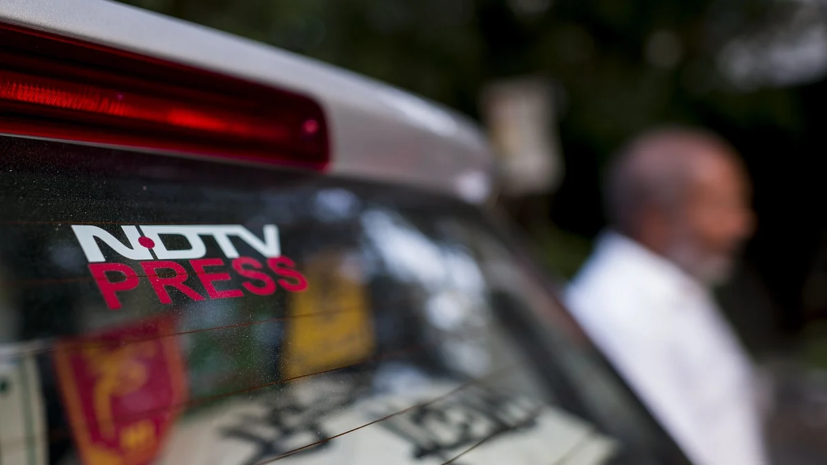 <div class="paragraphs"><p>Signage of the New Delhi Television Ltd. (NDTV) on a car parked inside. Photographer: Anindito Mukherjee/Bloomberg</p></div>