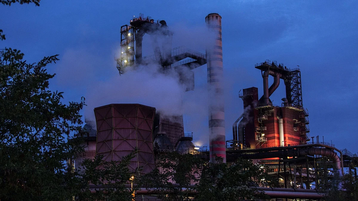 Emissions rise from chimneys at the Thyssenkrupp AG steel plant at dawn in Duisburg, Germany, on Tuesday, Oct. 20, 2020. Liberty Steel said it's made a non-binding indicative offer for Thyssenkrupp's steel unit, as the German conglomerate continues restructuring efforts to ensure its survival. Photographer: Sarah Pabst/Bloomberg