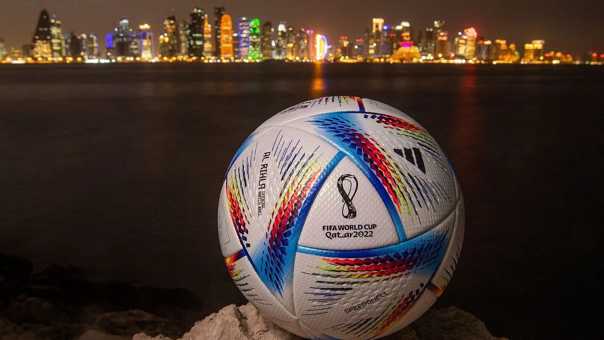 DOHA, QATAR - MARCH 31: In this photo illustration an official FIFA World Cup Qatar 2022 ball sits on display in front of the skyline of Doha ahead of the FIFA World Cup Qatar 2022 draw on March 31, 2022 in Doha, Qatar. (Photo by David Ramos/Getty Images)