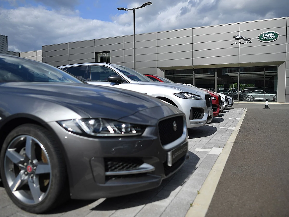 Jaguar Land Rover is reducing vehicle output in the UK through March Photographer: Ben Stansall/AFP/Getty Images