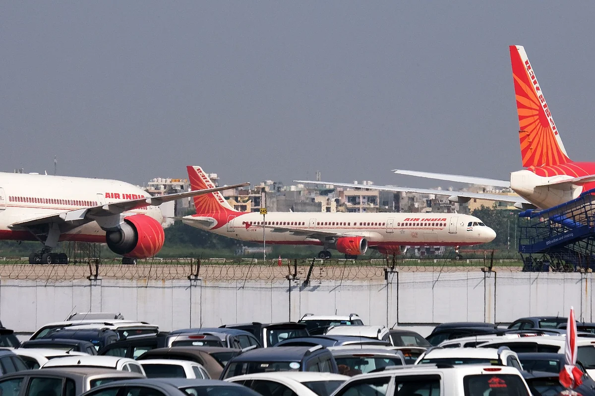 An Air India Ltd. aircraft taxis past other aircraft operated by the airline at the Indira Gandhi International Airport in New Delhi, India, on Tuesday, Sept. 28 2021. The India government is attempting to sell state-run Air India after two failed attempts. Despite the mounting debt and losses, the airline has some lucrative assets, including valued slots at London's Heathrow airport, a fleet of more than 100 planes and thousands of trained pilots and crew.