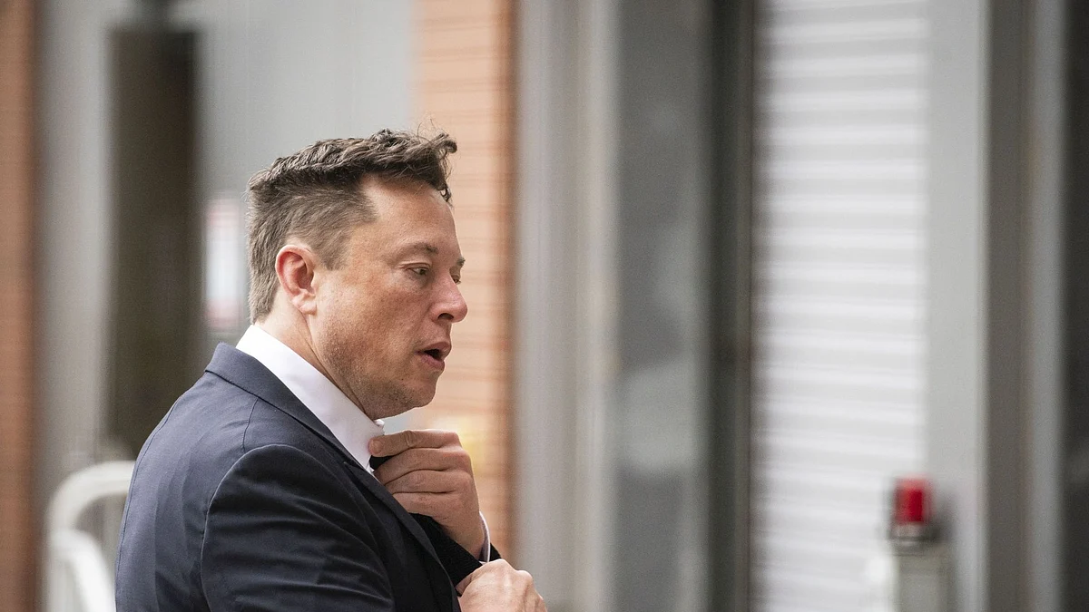 Elon Musk, chief executive officer of Tesla Inc., arrives at court during the SolarCity trial in Wilmington, Delaware, U.S., on Tuesday, July 13, 2021. Musk was cool but combative as he testified in a Delaware courtroom that Tesla's more than $2 billion acquisition of SolarCity in 2016 wasn't a bailout of the struggling solar provider.