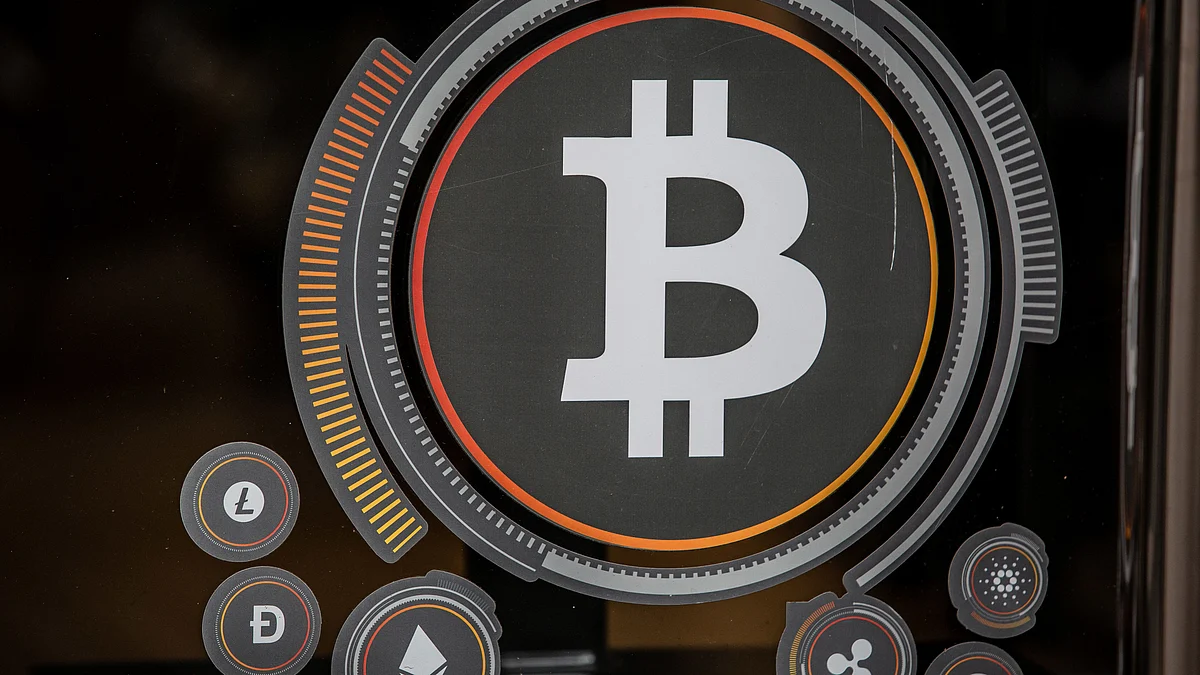 A Bitcoin logo inside a cryptocurrency exchange in Barcelona, Spain, on Wednesday, March 9, 2022. Bitcoin dropped back below $40,000, erasing almost all the gains sparked by optimism about U.S. President Joe Biden’s executive order to put more focus on the crypto sector. Photographer: Angel Garcia/Bloomberg