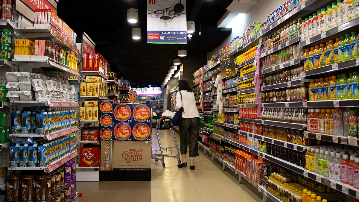 <div class="paragraphs"><p>A customer looking at products inside a supermarket. (Photo: Hobi Industri / Unsplash)</p></div>