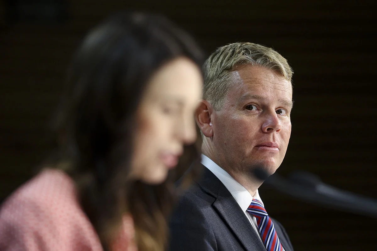 WELLINGTON, NEW ZEALAND - JANUARY 26: Minister for COVID-19 Response Chris Hipkins (R) looks on Prime Minister Jacinda Ardern speaks to media during a press conference at Parliament on January 26, 2021 in Wellington, New Zealand. Ardern said that the Government could approve a COVID-19 vaccine as soon as Wednesday, February 3. New Zealand's first shipment of the Pfizer-BioNTech vaccine is due to arrive by the end of March with a priority focus on border workers. (Photo by Hagen Hopkins/Getty Images)