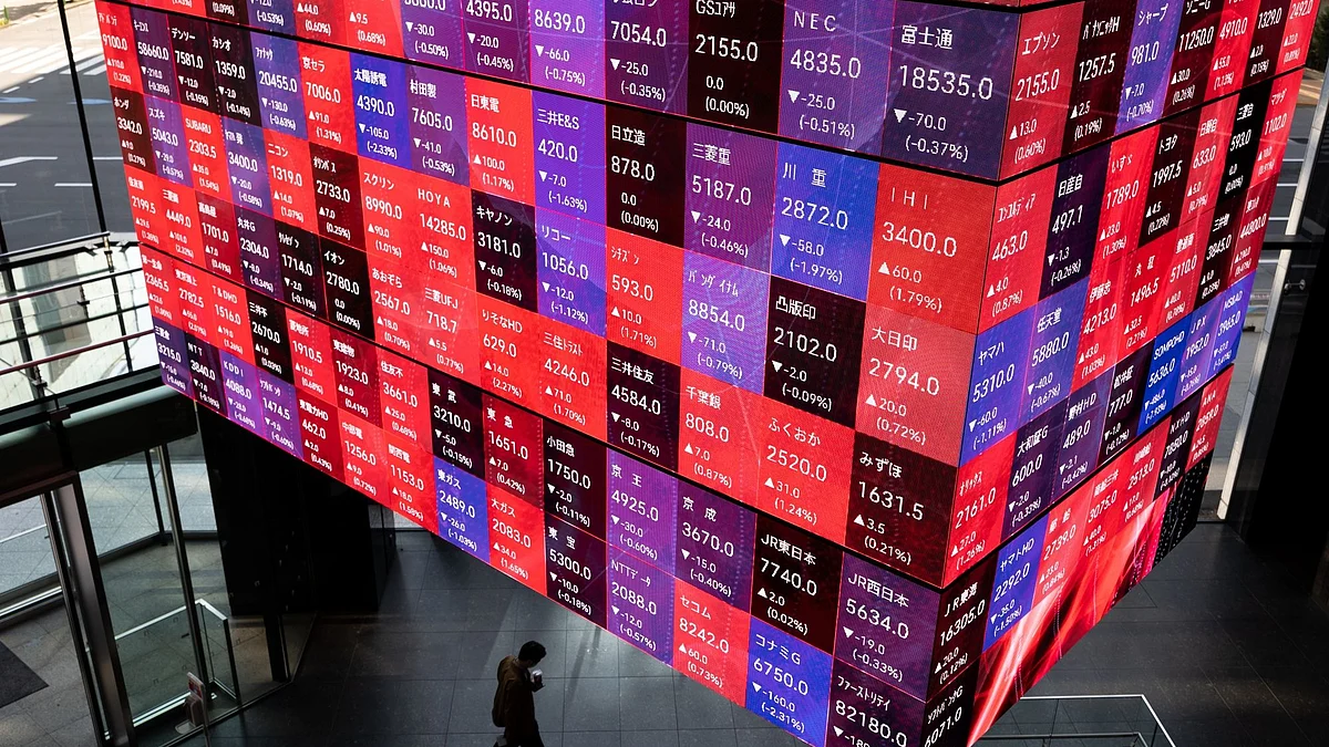 An electronic stock board inside the Kabuto One building in Tokyo, Japan, on Monday, Nov. 21, 2022. The world's central banks must keep raising interest rates to fight soaring and pervasive inflation, even as the global economy sinks into a significant slowdown, the OECD said. Photographer: SeongJoon Cho/Bloomberg