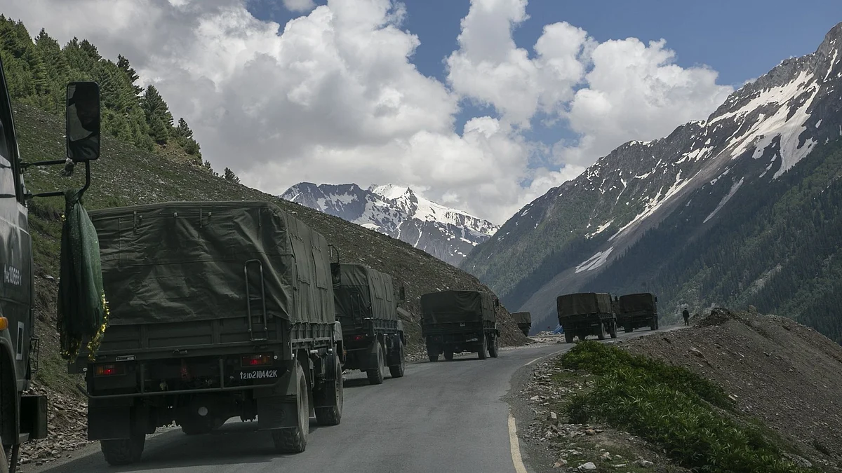 LADAKH, INDIA - JUNE 13: An Indian army convoy, carrying reinforcements and supplies, travels towards Leh through Zoji La, a high mountain pass bordering China on June 13, 2021 in Ladakh, India. The Zoji La mountain pass, considered to be the world's second most dangerous pass at 3529 metres, connects Kashmir Valley and Ladakh. Infrastructural developments along the borders have been ramped up amid the ongoing military tensions with China. (Photo by Yawar Nazir/Getty Images)