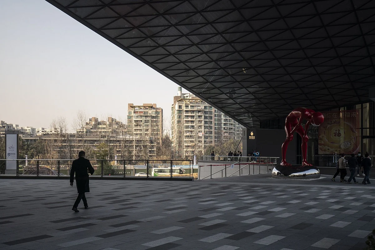 An employee walks through the campus of the Ant Group Co. headquarters in Hangzhou, China, on Wednesday, Jan. 20, 2021. Ant Co-Founder Jack Ma resurfaced for the first time since China’s government began clamping down on his business empire nearly three months ago, appearing in a live-streamed video that sent Ant affiliate Alibaba Group Holding Ltd.'s stock soaring but left plenty of unanswered questions about the billionaire’s fate. Photographer: Qilai Shen/Bloomberg