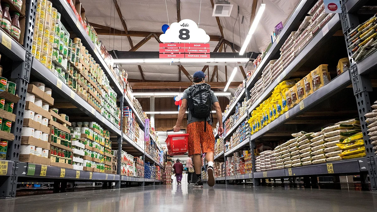 Shoppers browse items inside a Grocery Outlet Holding Corp. store in San Francisco, California, U.S., on Thursday, June 20, 2019. Grocery Outlet Holding rose in its trading debut after raising $378 million in an above-range initial public offering. The discount supermarket chain's shares, which rose as much as 43% Thursday, closed up 30% to $28.51, valuing the company at $2.44 billion. Photographer: David Paul Morris/Bloomberg