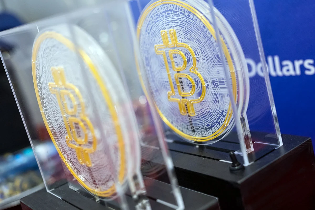 The Bitcoin logo on souvenirs during the listing ceremony for the CSOP Bitcoin Futures and CSOP Ether Futures exchange-traded funds (ETFs) at the Hong Kong Stock Exchange in Hong Kong, China, on Friday, Dec. 16, 2022. A pair of Hong Kong ETFs investing in Bitcoin and Ether futures raised $79 million as the city pushes ahead with a plan to become a crypto hub even as the sector globally reels from the FTX collapse.