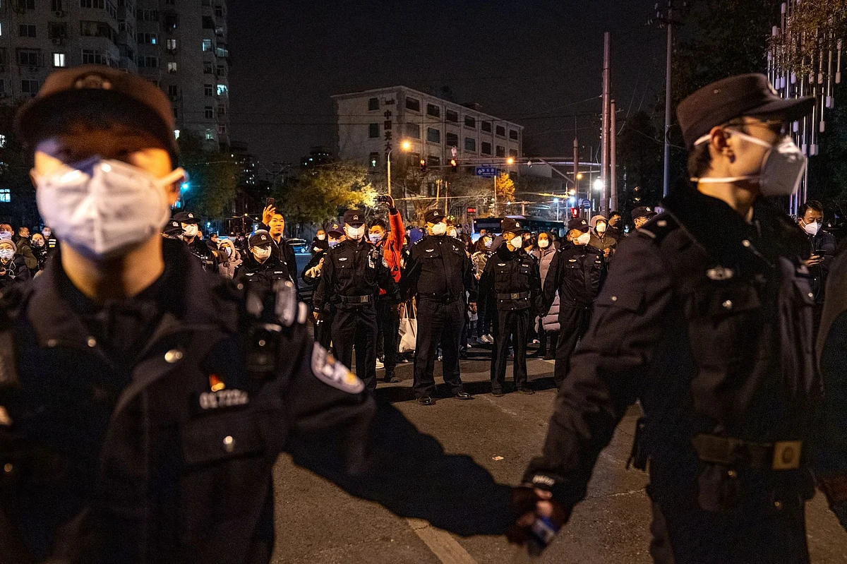 Police officers stand guard during a protest in Beijing, in Nov. 2022.