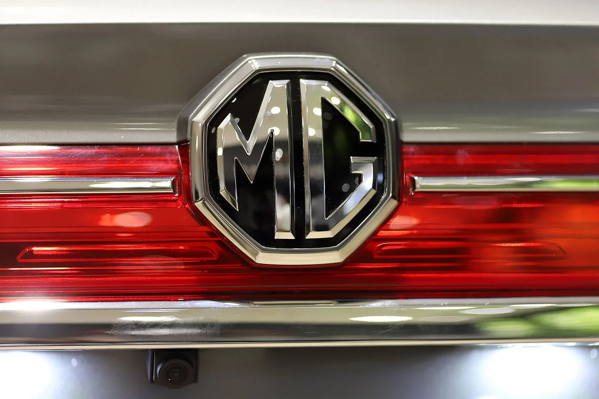 An MG badge is displayed on an MG Hector sports utility vehicle (SUV) during the vehicle's launch at the Morris Garages flagship showroom in Gurugram, Haryana, India, on Thursday, June 27, 2019. The launch of the Hector from the iconic brand MG, now owned by Chinese giant SAIC Motor Corp., marks the first Chinese entrant in a notoriously difficult market where the likes of General Motors Co. and Ford Motor Co. have struggled. Photographer: Anindito Mukherjee/Bloomberg
