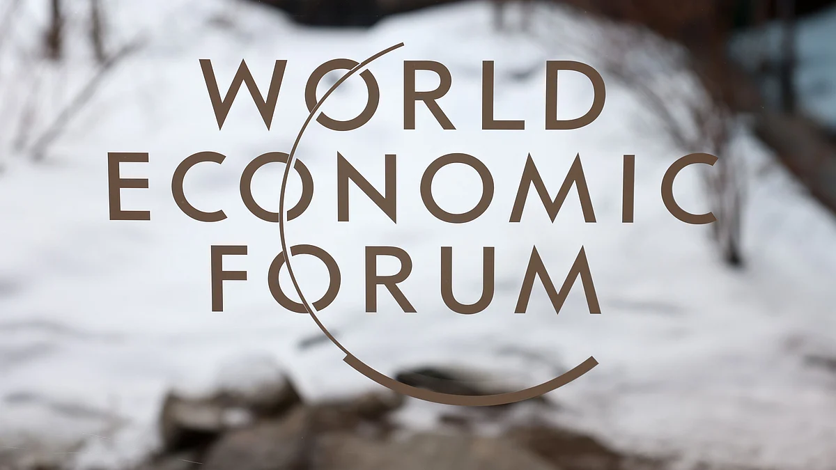 The logo the World Economic Forum (WEF) on a window inside the Congress Centre in Davos, Switzerland, on Monday, Jan. 16, 2023. The annual Davos gathering of political leaders, top executives and celebrities runs from January 16 to 20. Photographer: Hollie Adams/Bloomberg