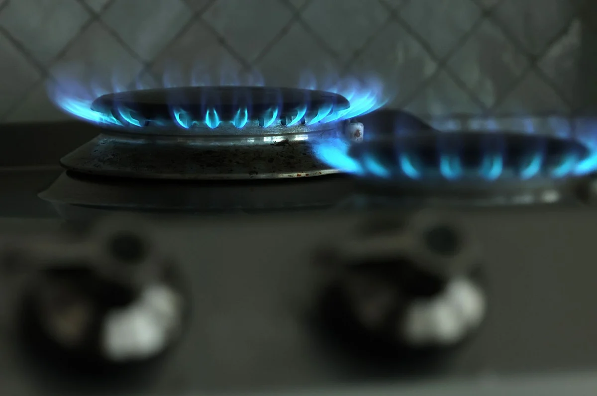 BERLIN, GERMANY - AUGUST 19: In this photo illustration a gas flame burns on a gas stove top on August 19, 2022 in Berlin, Germany. The German government, faced with skyrocketing prices for natural gas, is wrestling with policies designed to alleviate the hike in prices for consumers and businesses yet at the same time create a financial cushion for gas providers and utilities. Germany and other countries in Europe still import a significant portion of their gas from Russia. Russia has responded to western sanctions by significantly lowering the flow of its natural gas exports to western Europe. (Photo by Sean Gallup/Getty Images)