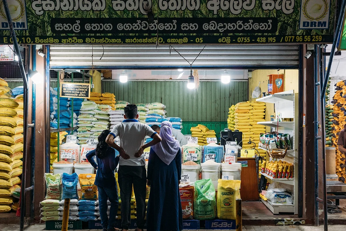 Shoppers at a grains stall at the Narahenpita Economic Centre in Colombo, Sri Lanka, on Sunday, May 22, 2022. Sri Lanka’s dollar bonds due July rebound after Friday’s drop, up almost 5 cents on the dollar in the biggest gain since October, as the government holds bailout talks with the IMF. Photographer: Jonathan Wijayaratne/Bloomberg