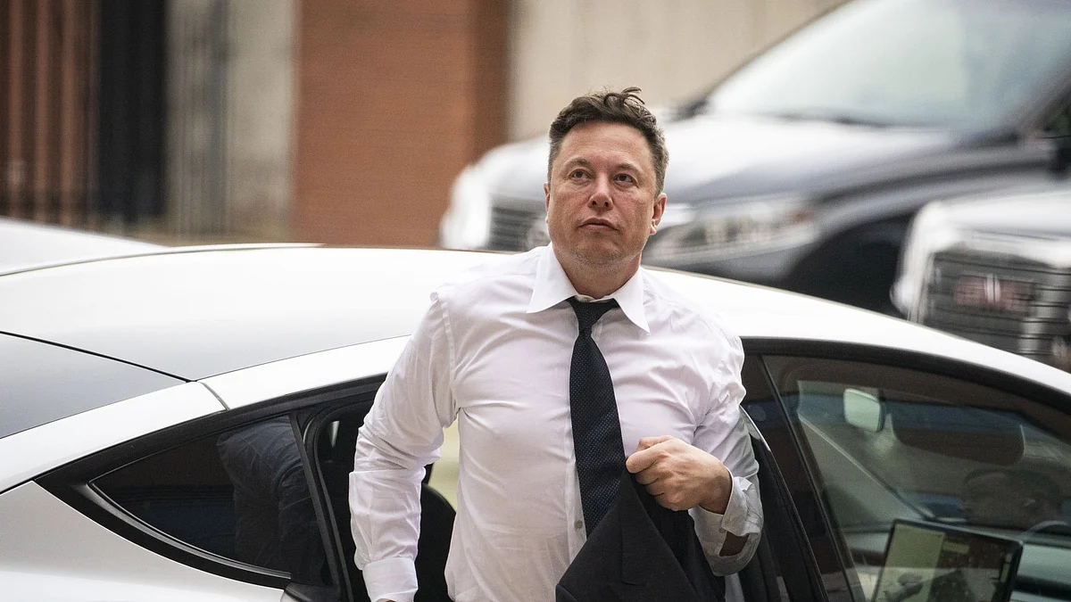 Elon Musk, chief executive officer of Tesla Inc., arrives at court during the SolarCity trial in Wilmington, Delaware, U.S., on Tuesday, July 13, 2021. Musk was cool but combative as he testified in a Delaware courtroom that Tesla's more than $2 billion acquisition of SolarCity in 2016 wasn't a bailout of the struggling solar provider.