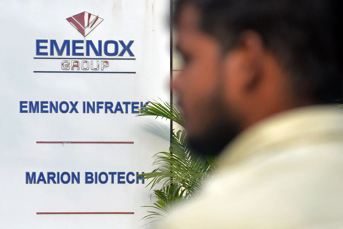 A man walks past the office enterance of Marion Biotech, a pharmaceutical company in Noida on the outskirts of New Delhi on December 29, 2022. Photographer: -/AFP/Getty Images