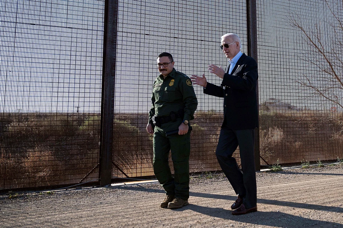 President Biden walks along the US-Mexico border fence in El Paso on January 8. Photographer: Jim Watson/AFP/Getty Images