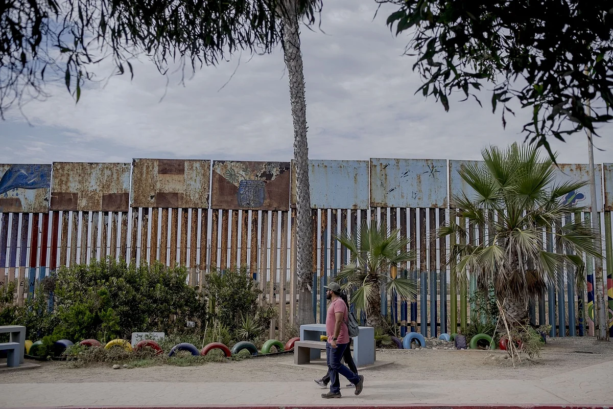 A section of the Mexico and US border fence in Tijuana, Mexico, on Sunday, Aug. 7, 2022. Mexican migrants attempting to cross into the US without adequate documentation outnumbered those from Central America in the first six months of this year, a reversal after a slowdown due to the Covid-19 pandemic.
