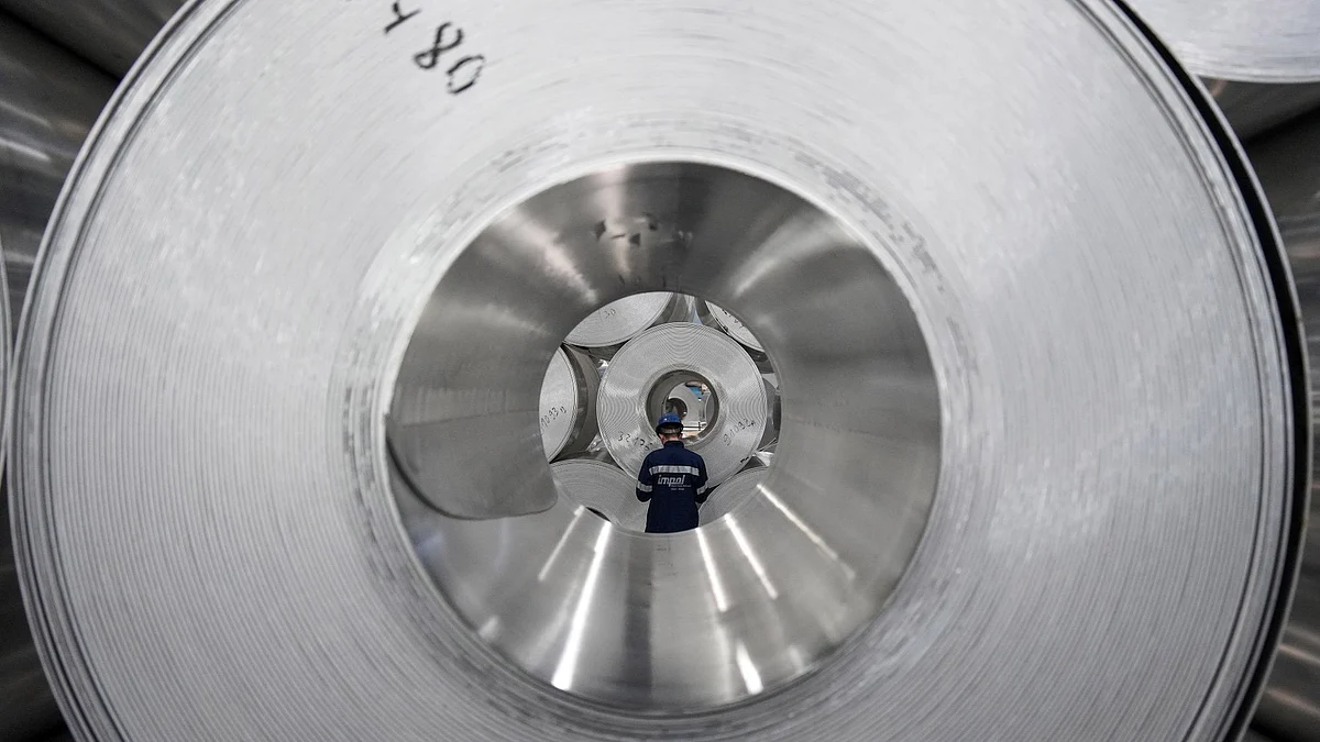 A worker checks the inventory of rolls of sheet aluminum at the Impol Seval AD Sevojno plant in Sevojno, Serbia, on Thursday, March 17, 2022. The cooling of metal markets contrasts with the sharp moves higher earlier this month, when both copper and aluminum touched new records.