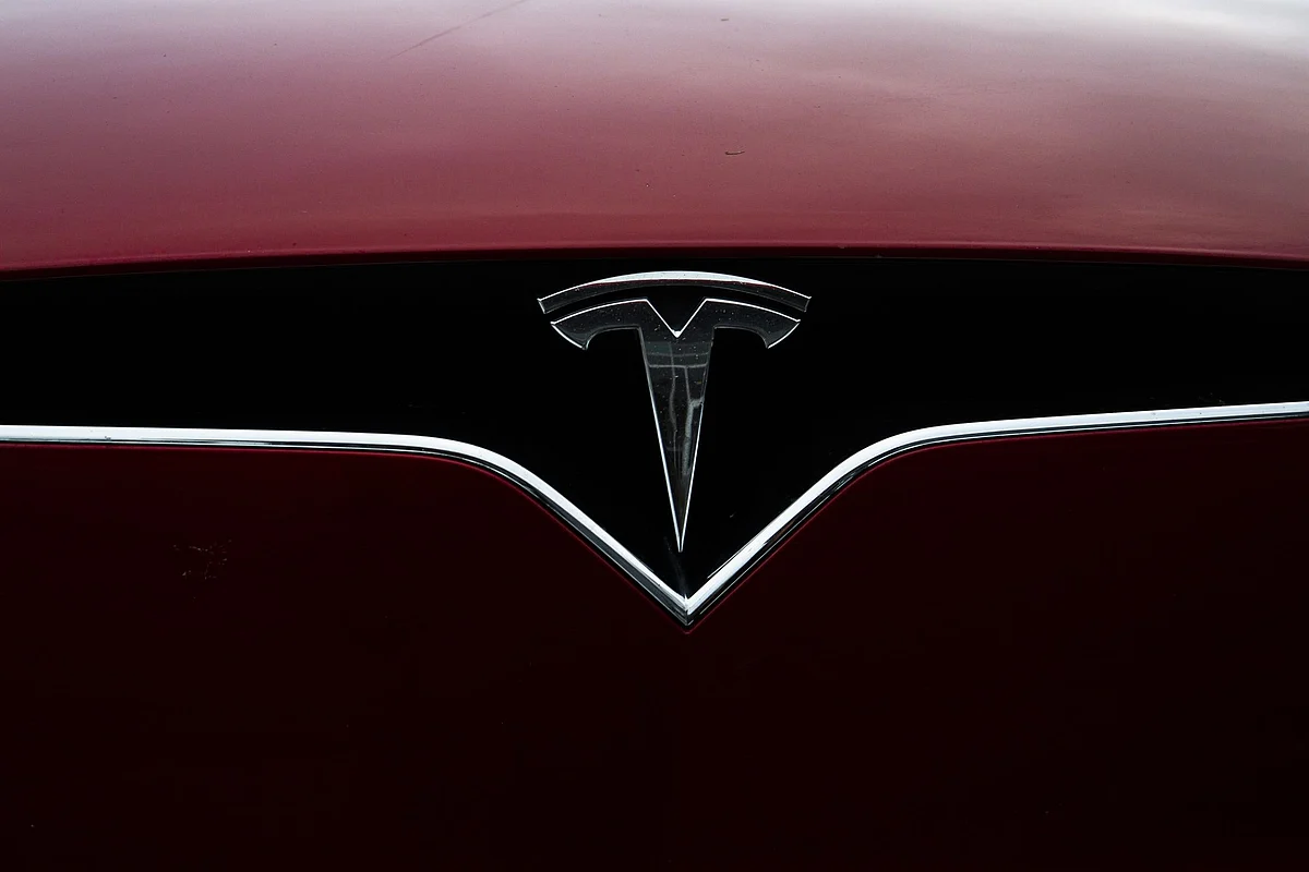 A logo is displayed on a Tesla Inc. electric vehicle charging at the Tesla Supercharger station in Fremont, California, U.S., on Monday, July 20, 2020. Tesla Inc. is scheduled to release earnings figures on July 22. Photographer: Nina Riggio/Bloomberg