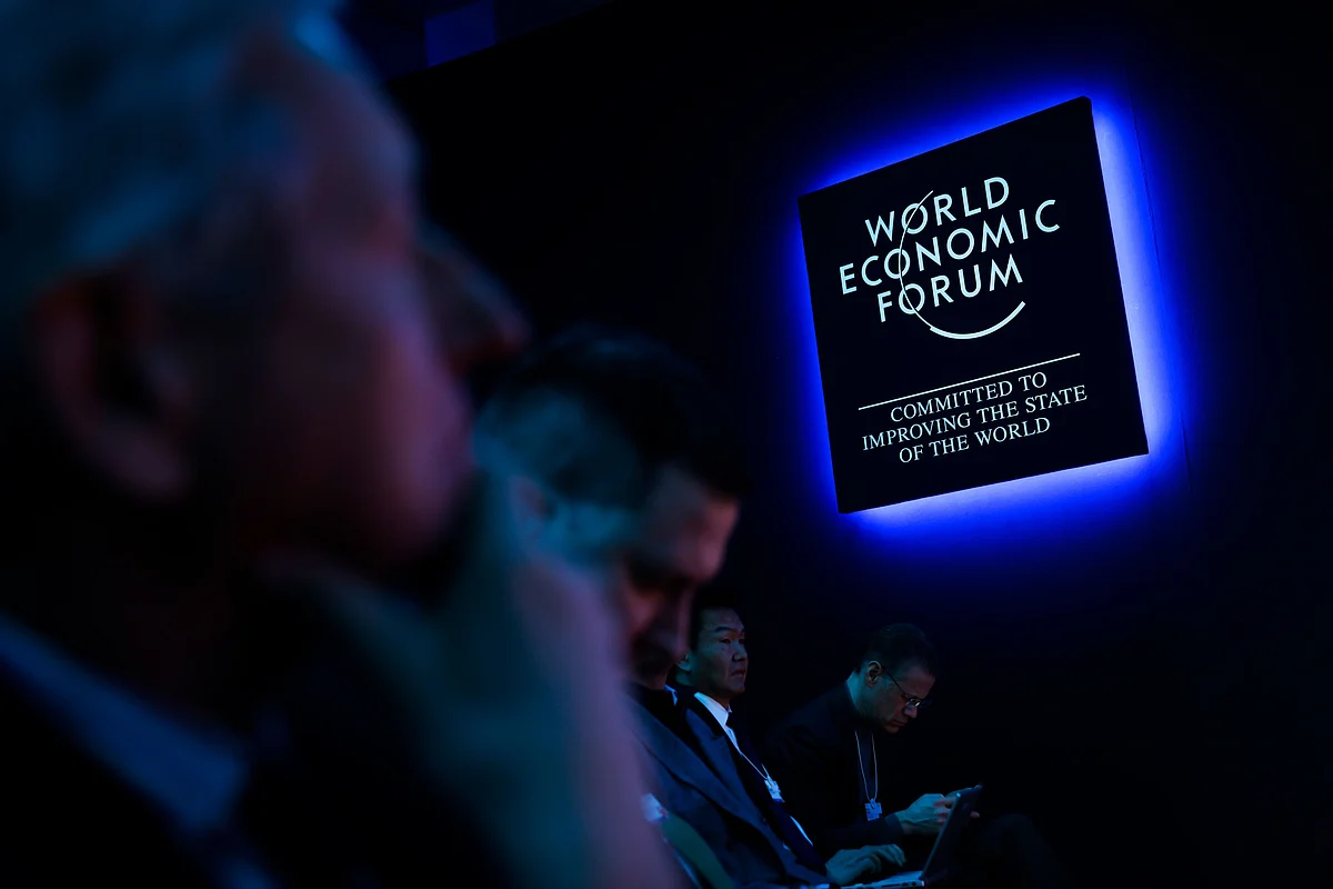 An illuminated logo during a panel session on the opening day of the World Economic Forum (WEF) in Davos, Switzerland, on Tuesday, Jan. 17, 2023. The annual Davos gathering of political leaders, top executives and celebrities runs from January 16 to 20. Photographer: Stefan Wermuth/Bloomberg