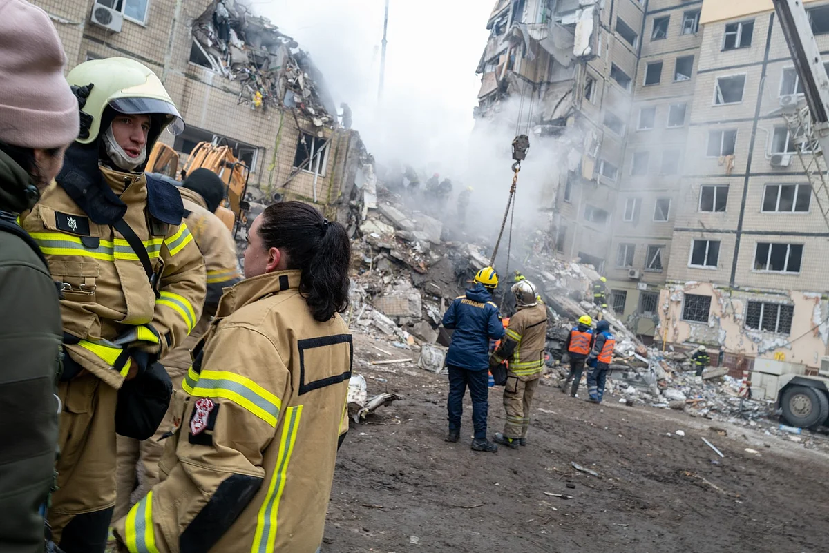 Emergency workers at the site of a Russian missile attack in Dnipro, Ukraine.