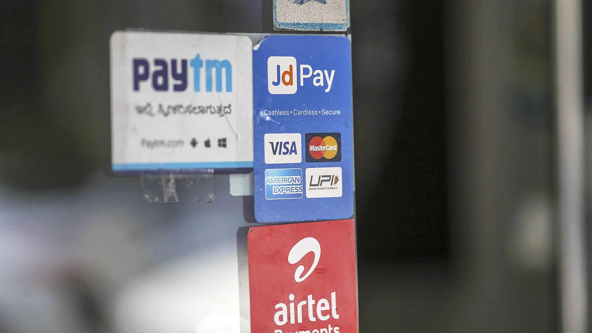 Signage for digital payments services Paytm, operated by One97 Communications Ltd., top left, JD Pay, operated by Just Dial Ltd., top right, and Airtel Payments Bank Ltd., operated by Bharti Airtel Ltd., are displayed at a store selling electronics in Bengaluru, India, on Saturday, Feb. 4, 2017. A relative laggard in digital transactions, India has more recently seen 50 percent year-on-year growth, according to a study by Google and Boston Consulting Group. The pace may accelerate with demonetization giving digital wallets like Paytm, MobiKwik and Freecharge an extra push.