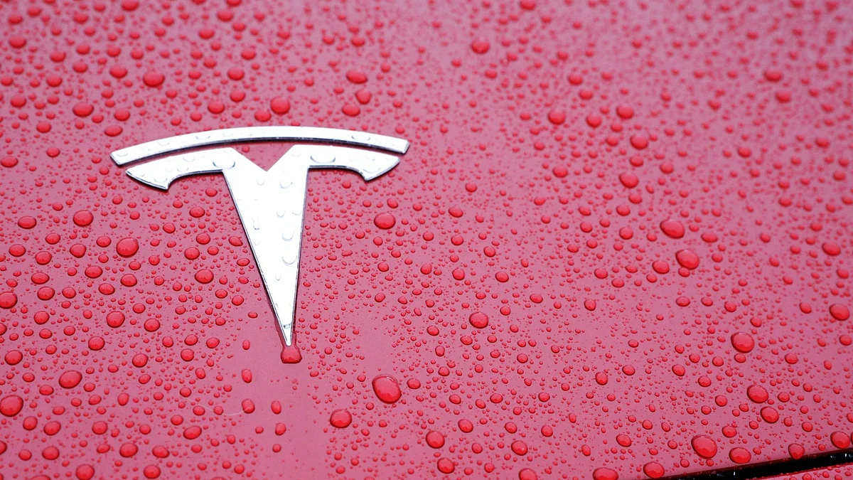 Rain drops surround a Tesla Inc. logo on a Model 3 vehicle ahead of an event at the site of the company's manufacturing facility in Shanghai, China, on Monday, Jan. 7, 2019. After four years of planning, Tesla finally broke ground on its planned $5 billion factory in the world's biggest auto market. Photographer: Qilai Shen/Bloomberg