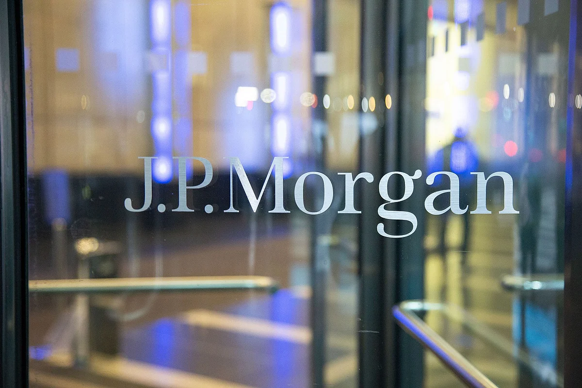 The J.P. Morgan logo sign on the entrance of a glass office building in Midtown Manhattan. Photographer: Nicolas Economou/NurPhoto/Getty Images