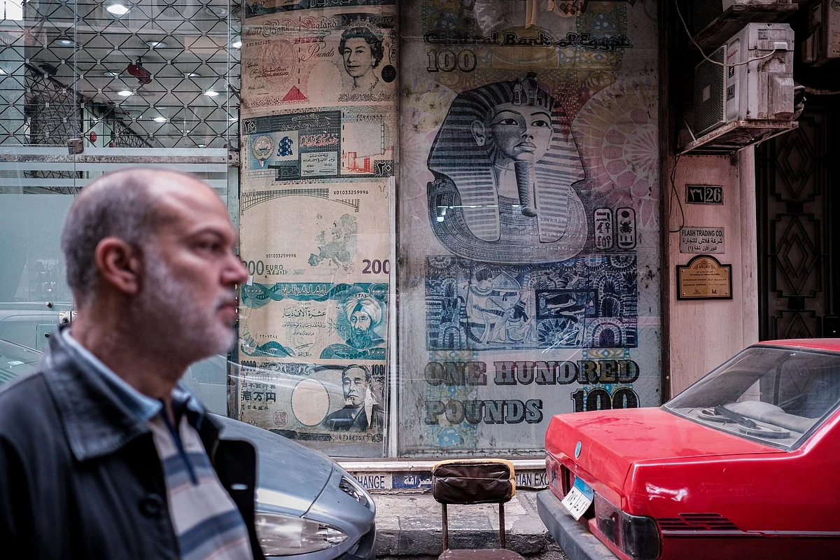 Images of Egyptian and foreign currency banknotes in the window of a currency exchange bureau in the Zamalek district of Cairo, Egypt, on Saturday, Jan. 7, 2023. Egypt’s urban inflation accelerated at its fastest pace in five years as several rounds of currency devaluation filtered through to consumers.