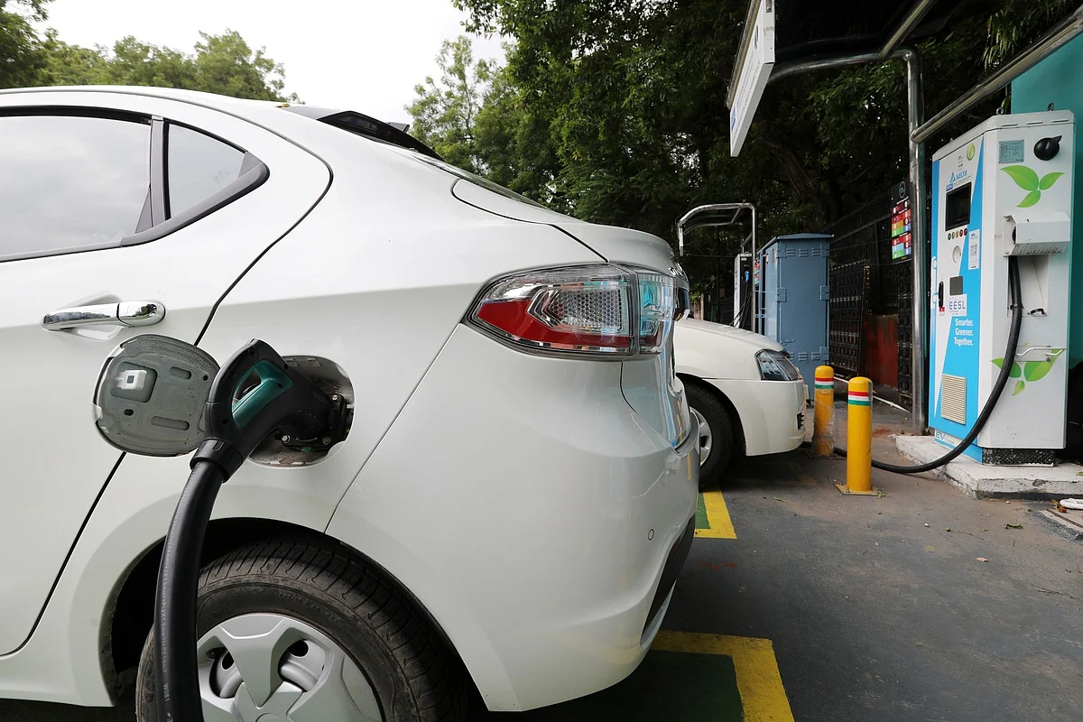 An electric vehicle (EV) is connected at a charging station operated by Energy Efficiency Services Ltd. (EESL), a joint venture between four state-run power companies -- NTPC Ltd., Power Grid Corp., Power Finance Corp. and REC Ltd., in New Delhi, India, on Tuesday, Aug. 25, 2020. India aspires to rapidly scale-up local manufacturing and adoption of electric vehicles to raise its competitiveness in the global auto-manufacturing industry as well as to tackle its high fuel import bill and urban pollution. Photographer T. Narayan/Bloomberg