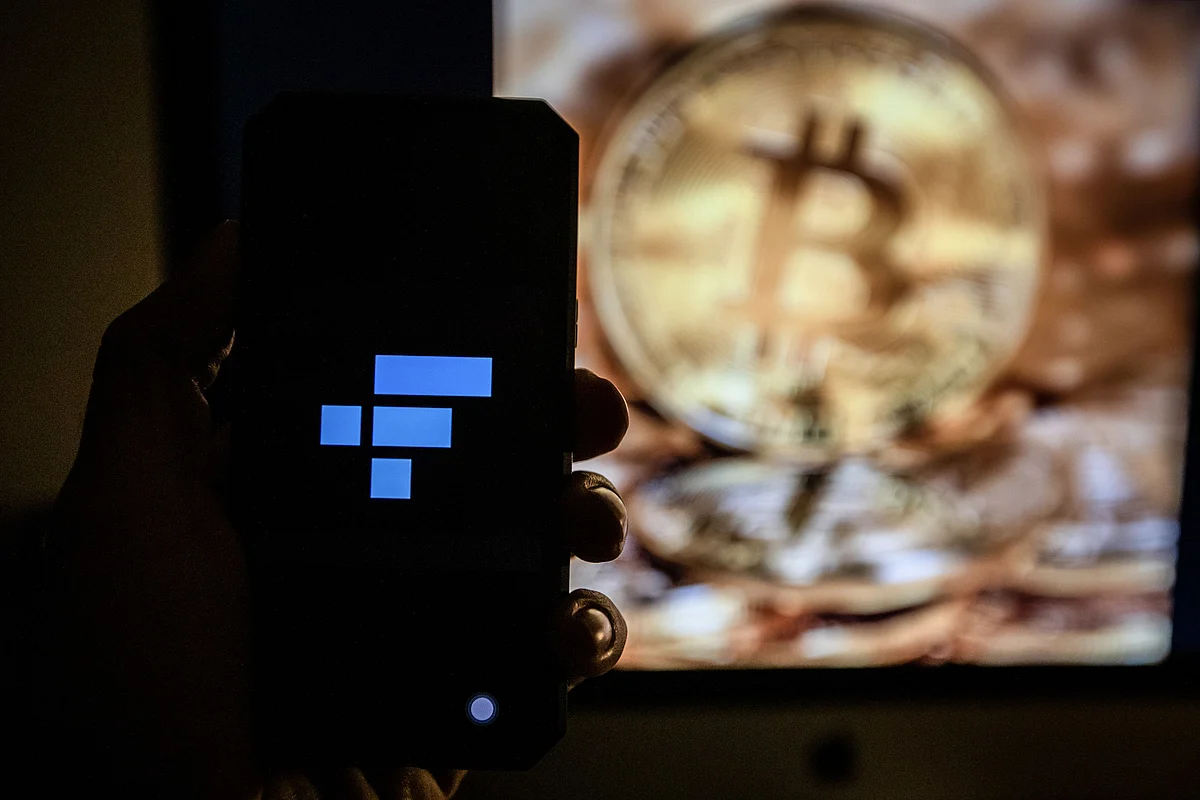 The FTX logo on a smartphone arranged in Barcelona, Spain, on Tuesday, Nov. 15, 2022. FTX Group named a slate of new independent directors to oversee the collapsed crypto empire and said its bankruptcy may involve more than a million creditors. Photographer: Angel Garcia/Bloomberg