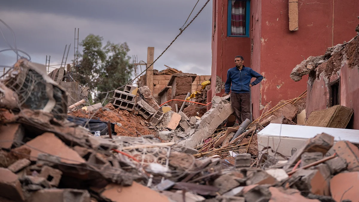 A resident stands among the ruins of a collapsed building following an earthquake in Ouirgane, Morocco.Photographer: Nathan Laine/Bloomberg