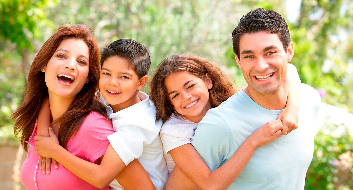 Portrait of Happy Family In Park