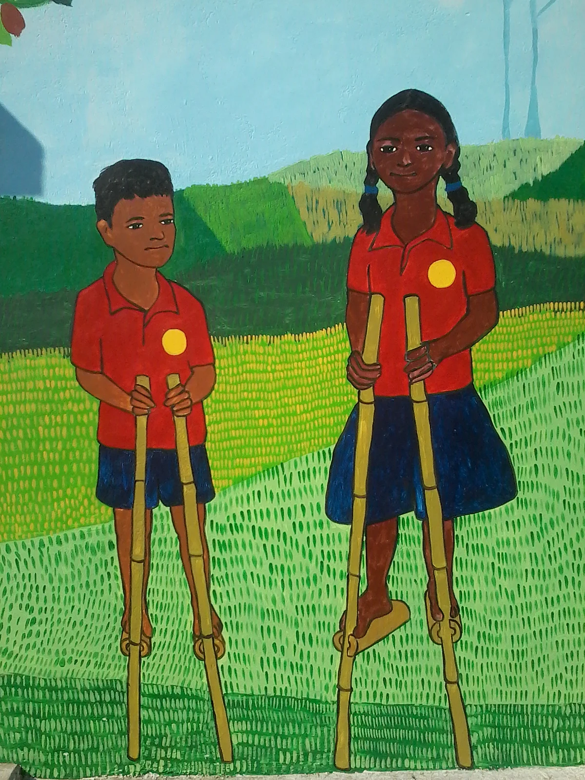 Hemalkasa - children walking on bamboo sticks in Lok Biradari