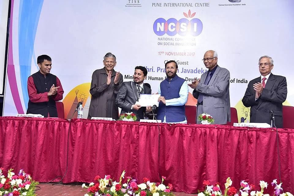 Receiving an award for social innovation for his start-up