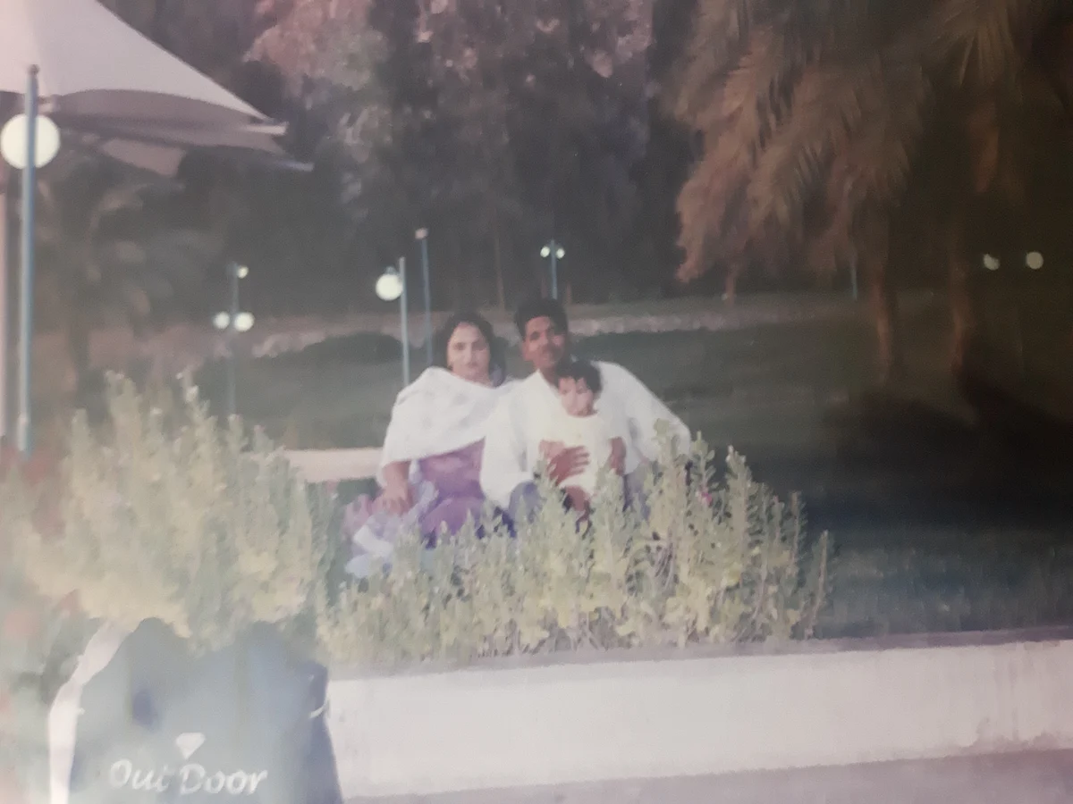 Little me with my parents at a park