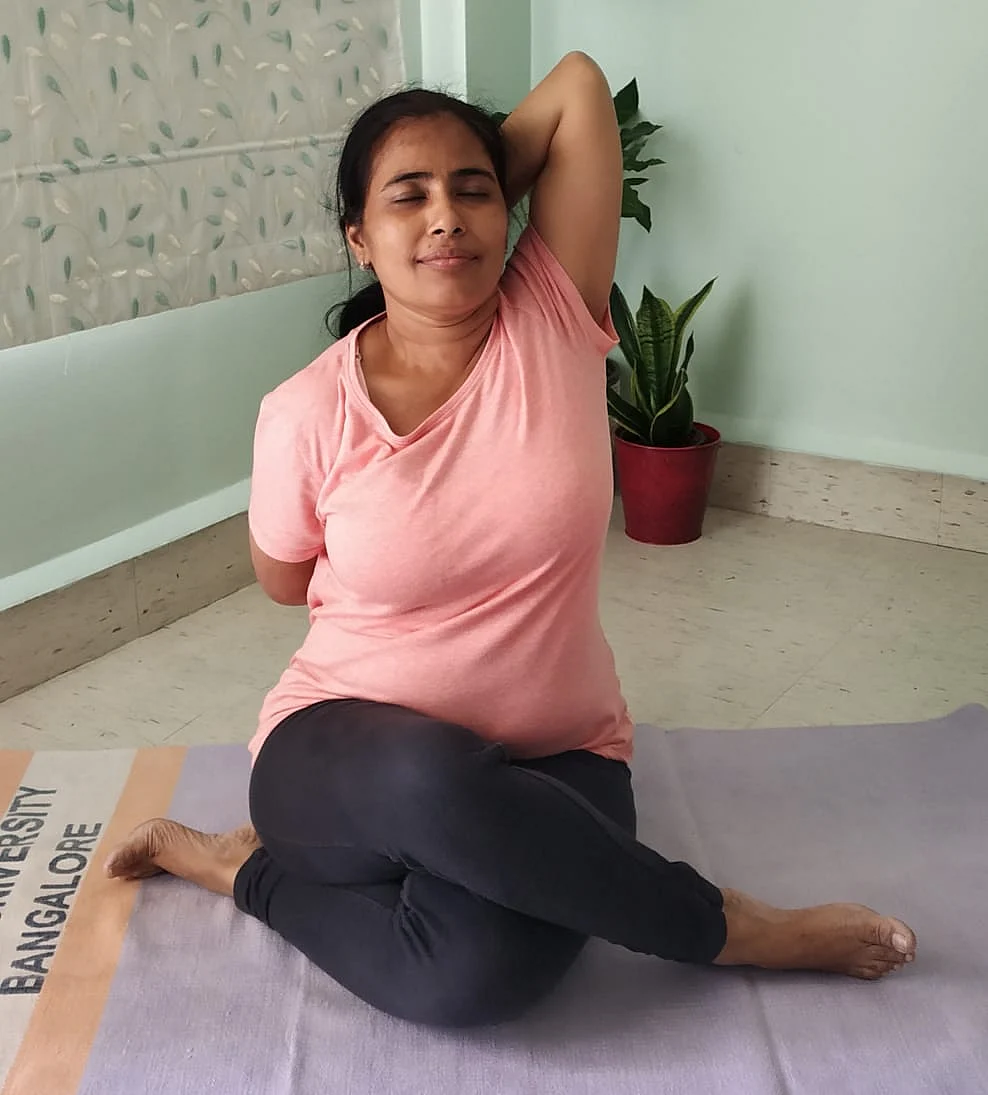 Dr Jyo doing the triceps stretch