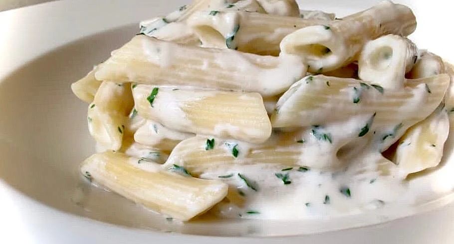 Penne White Sauce: Penne cooked in a creamy sauce and finished with cheese prepared by Chef Karan