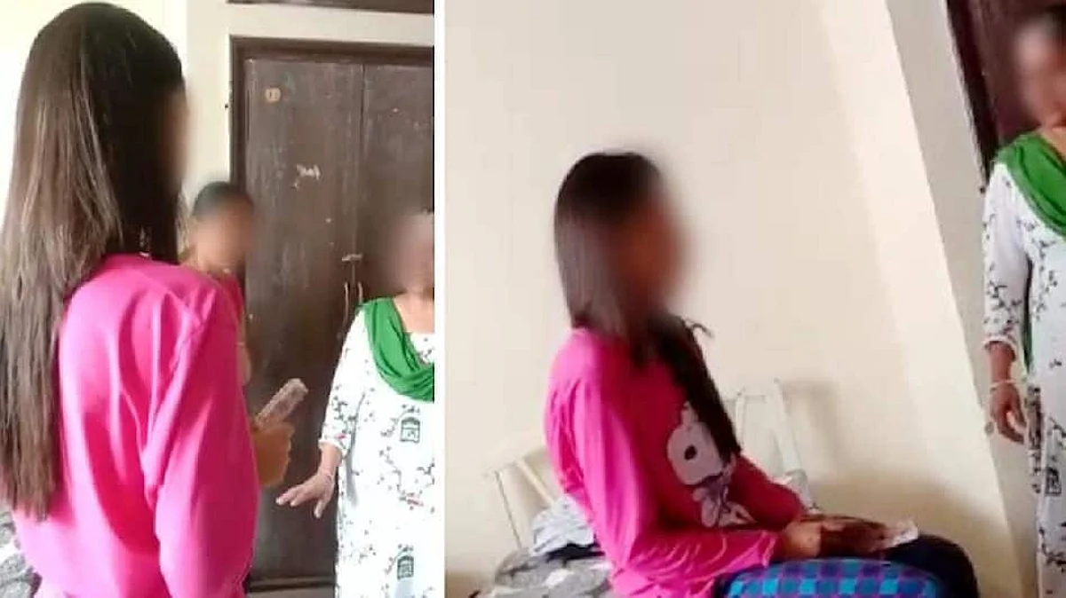आरोपी छात्रा को फटकार लगाती हुई वार्डन