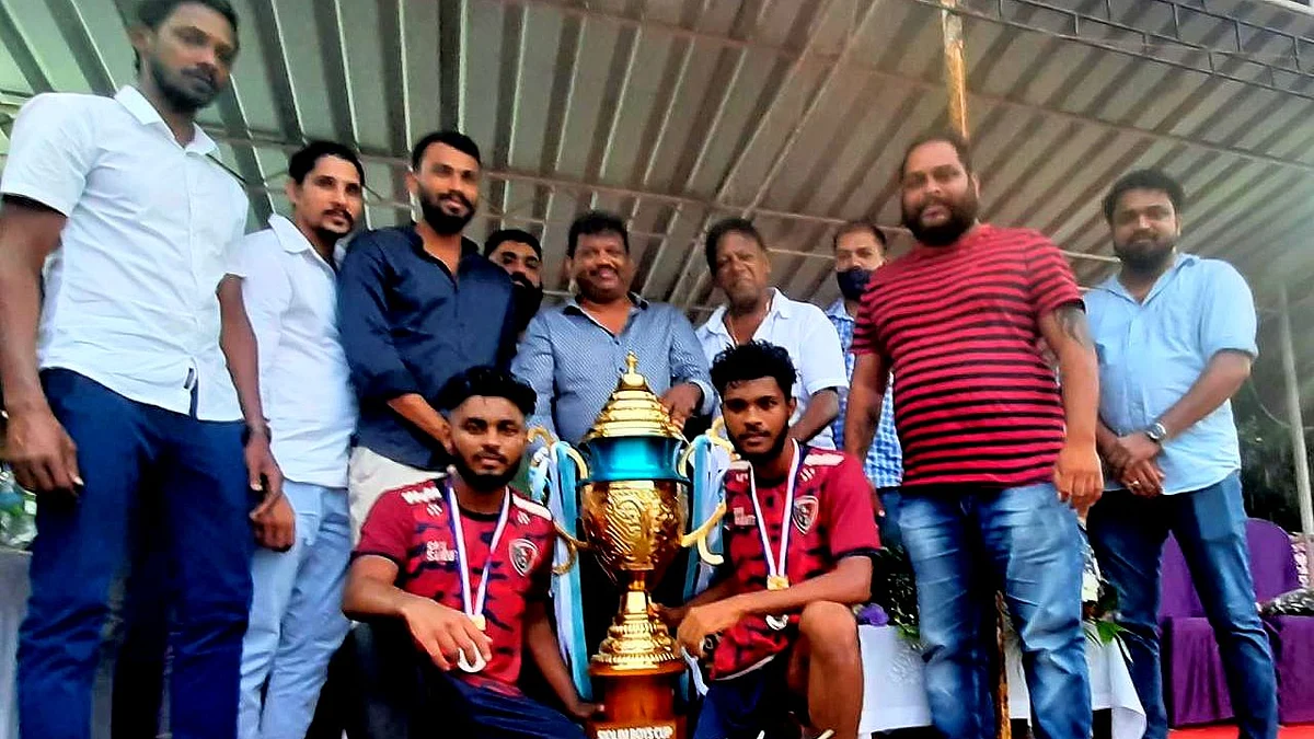 Mitchell Lobo with the winning team at the football tournament at Siolim. Goa