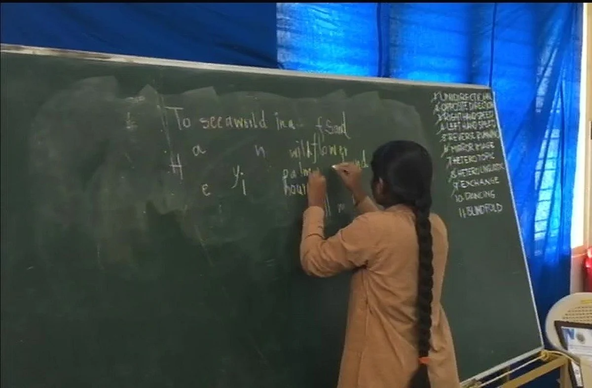 Aadi Swaroopa writing with both hands