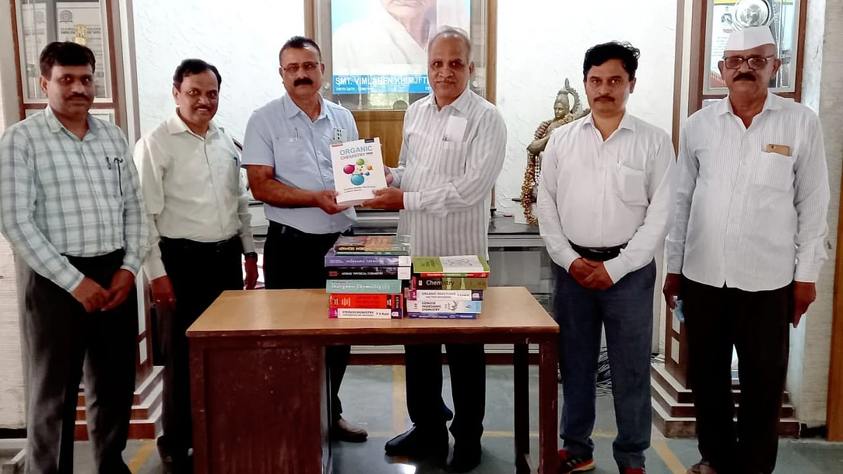 Former Vice Principal gifts reference books to college