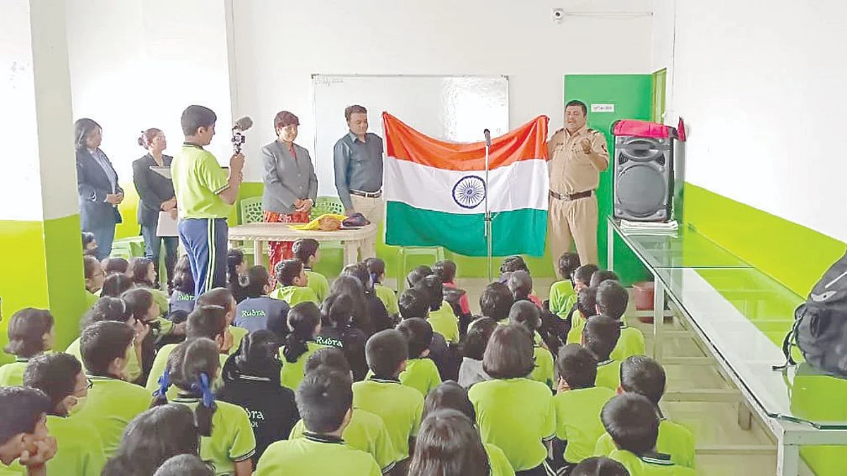 Police guiding children on rules of flag hoisting