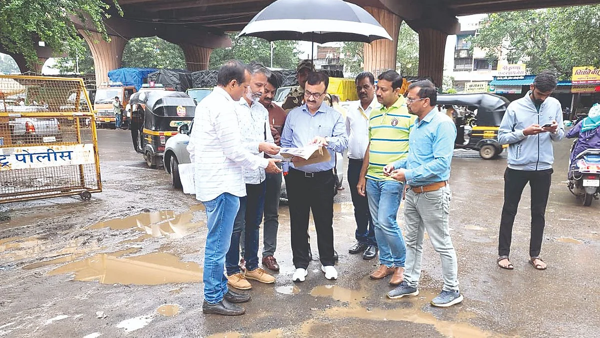Municipal commissioner reviews road repair works