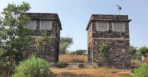 These towers inside the NIIT University in Neemrana, Rajasthan, collect hot air from the outside, which is then naturally cooled through underground tunnels and used for air conditioning campus buildings (Photograph: Sugeet Grover; Illustrations Courtesy: CSE Report And Nzeb.In)