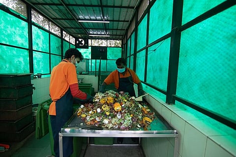 House keeping staff managing segregated wet waste at a plant in Close South Nirvana, Gurugram. Photo: Vikas Choudhary / CSE