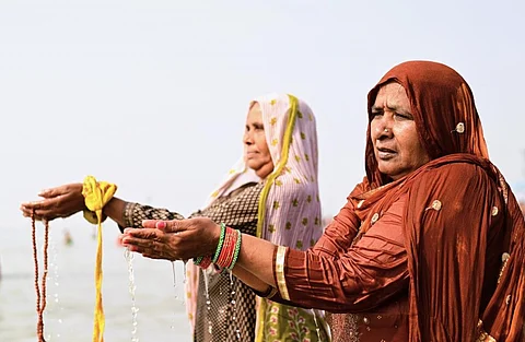 Pilgrims take holy baths in Ganga Sagar at the confluence of Bay of Bengal and Ganga river (Hooghly) on Sagar Island. Photo: Jayanta Basu