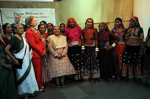 SEWA members and artisans with US Secretary of State Hillary Rodham Clinton in Gujarat on July 18, 2009. Photo: US State Department via Wikimedia Commons. Public Domain